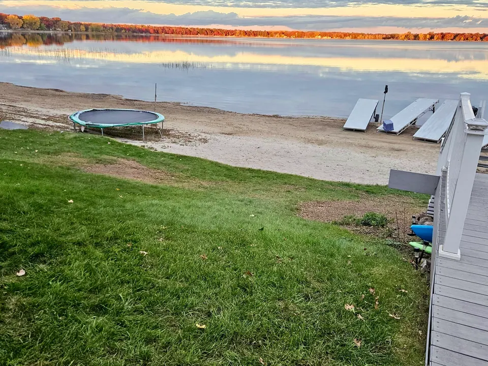 Open lakeshore lawn with a clear view of the lake